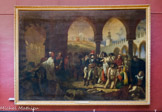 <center>Bonaparte visitant les pestiférés de Jaffa (11 mars 1799). 1804.</center>Baron Antoine-Jean GROS. Paris, 1771 – Meudon, 1835. Ce vaste tableau, commande officielle, illustre un épisode de la campagne de Syrie en glorifiant 1'attitude du général Bonaparte visitant les malades, au mépris de la contagion, pour relever le moral des troupes. Devenu Premier consul pendant l'exécution de l'œuvre, il y est montré, par flatterie, renouvelant le geste des rois touchant les écrouelles. Avec cette toile, Gros, élève de David, rompt avec renseignement du maître. Tout y est innovation : le thème héroïque emprunté à l'histoire contemporaine, le réalisme anatomique et ethnique des participants de la scène, la composition qui abandonne l'ordonnance classique, l'éclairage contrasté groupant des masses, la sonorité de la couleur rappelant les grands Vénitiens et Rubens, le décor de la mosquée qui est une des premières manifestations de l'orientalisme au XIXe siècle. Tous ces caractères placent l'œuvre au seuil de la peinture romantique et moderne. Le tableau connaît un immense succès au Salon de 1804, et vaut à son auteur l'ovation du public.