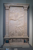 <center>Manufacture de Sèvres</center> Retable de Cognac. Girolamo Della Robbia (1488-1566). Ce retable provient d’une chapelle du château de Cognac, lieu de naissance de François Ier. Terre cuite émaillée. France. Mars 1530. Entre deux pilastres ornés de symboles se rapportant au roi François Ier et à sa mère Louise de Savoie, dont les écussons forment la base, la scène centrale en relief représente La Naissance de la Vierge, d'après une gravure d'Albrecht Dürer (1471-1528) éditée en 1511.
Peinte en grisaille sur la prédelle, La Rencontre à la porte Dorée, illustre la rencontre des futurs parents de la Vierge, Anne et Joachim, devant la porte de Jérusalem.