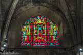<center>La Nef.</center>Vitrail du fond du collatéral sud.