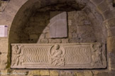 <center>Les travées des cryptes. </center>Enfeu de la religieuse Eusebia. Sarcophage dit « de sainte Eusébie ». Ve siècle, décor sur une grande face, marbre de Carrare. Cette cuve serait issue du cimetière du Paradis. Le buste du défunt dont le vêtement indique la classe sénatoriale, est représenté au centre dans un clipeus surmontant la scène de Jonas une fois rejeté sur la plage par le monstre. Deux panneaux de strigiles séparent les images centrales de celles des extrémités, évocatrices à la fois de Moïse et de Pierre. L'une, à gauche, représente Moïse frappant le rocher de l'Horeb afin d'abreuver le peuple d'Israël. Elle est relative, selon ce double sens, au peuple chrétien assoiffé de l'Évangile. L'autre, à droite, représente Moïse recevant les tables de la Loi. Elle doit être comprise comme évocation de la réception de l'Ancienne Loi et du Nouveau Testament.