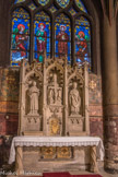 <center>Église Saint-Germain-l'Auxerrois.</center> La chapelle des Saints-Patrons. Autel néogothique. Retable en pierre de l’Ecole Française du XIXe siècle, sculpté par Louis Desprez en 1840. Saint Vincent et saint Germain, patrons de la paroisse, entourant la Sainte Trinité, Père, Fils et Esprit-Saint.