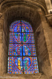 <center>Eglise Saint-Germain-des-Prés. </center> Vitrail de la chapelle Sainte-Geneviève. Ces vitraux sont caractéristiques de la production du XIIIe siècle et du règne de saint Louis. Ils sont constitués à partir de fragments de vitraux de la chapelle de la Vierge et du réfectoire des moines. Les Œuvres de miséricorde.