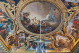 <center>Le salon d'Apollon. </center>  Les voussures illustrent la magnificence et la magnanimité du roi, au travers d’exemples tirés de l’Antiquité : à gauche, Coriolan levant le siège de Rome à la demande de sa mère, au centre, Vespasien faisant élever le Colisée à Rome, à droite, Auguste faisant bâtir le port de Misène. Les quatre continents sont représentés dans les quatre angles.