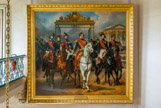 Le roi Louis-Philippe entouré de ses cinq fils sortant par la grille d'honneur du château de Versailles après avoir passé une revue militaire dans les cours, 10 juin 1837. A sa droite, le prince de Joinville, le duc de Montpensier, le duc d’Orléans, à sa gauche, les ducs de Nemours et d’Aumale. Lorsqu’Horace Vernet réalise cette composition, le duc d’Orléans est déjà mort, suite à un accident de cheval survenu en 1842 .