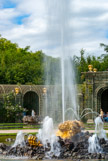 <center>Les jardins de Versailles.</center> Le bosquet de l'Encelade. Le sculpteur a représenté le géant Encelade à demi englouti sous un amoncèlement rocheux, luttant contre la mort et dont la souffrance se traduit par le puissant jet qui s’échappe de sa bouche, comme un cri.