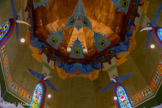 <center>Le château Laurens</center>Dans le registre le plus haut, de grandes draperies feintes rampent sur les parois murales d’où s’échappent des figures féminines : les unes sont dans l’axe des baies, et évoquent des sentinelles figées au visage masqué ; les autres (des muses ?) s’agitent au son d’une lyre stylisée, semblant figurer une folle danse.