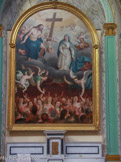 <center> Eglise de la Madeleine </center> Le tableau porte la signature d'un peintre appartenant à une famille, dont certains membres ont œuvré à la décoration de la chapelle de l'Annonciade. Il représente le Christ et sa mère, la Vierge Marie, occupés à faire monter du purgatoire les âmes qui ont payé leur droit d'entrée au paradis. Les anges s'activent pour aider la manœuvre. Mais tous ne sont pas appelés ! La croix du Christ, bien mis en valeur, rappelle que le salut est dû au sacrifice de Jésus. Le rôle de Marie est une croyance attestée depuis fort longtemps. Elle est femme, sans doute plus attentive à la souffrance de ceux et celles qui attendent, et elle est Mère de Dieu, comme la nomme le concile d'Éphèse en 431, donc toute-puissante sur le cœur de son fils.