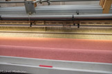 <center>La manufacture Brun de Vian-Tiran.</center>Le peigne qui tasse le fil de trame est la tige qui se trouve au milieu.