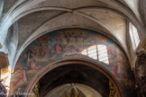 <center>La Collégiale Notre-Dame-des-Anges</center>En 1850, on eut l'idée malencontreuse de faire décorer d'une fresque la vaste surface, restée nue, qui entoure l'arc triomphal ; le peintre d'Avignon Joseph Lacroix s'acquitta de cette besogne fort contestée depuis lors. Le programme remis au peintre prétendait obtenir une représentation des 